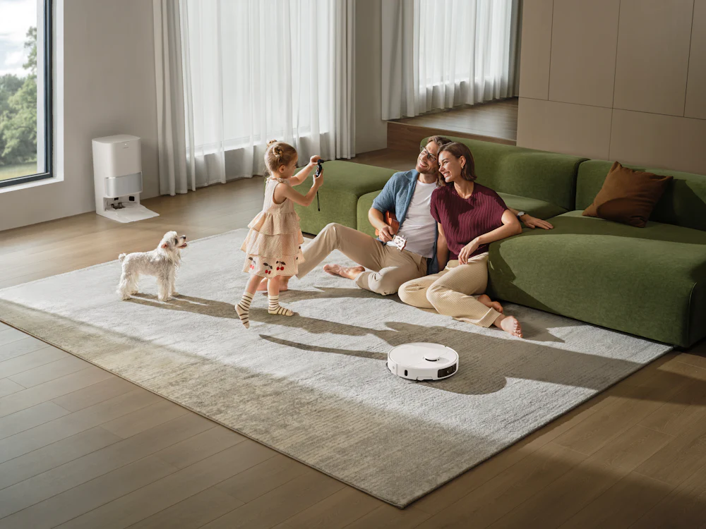 Family relaxing with their dog in a living room